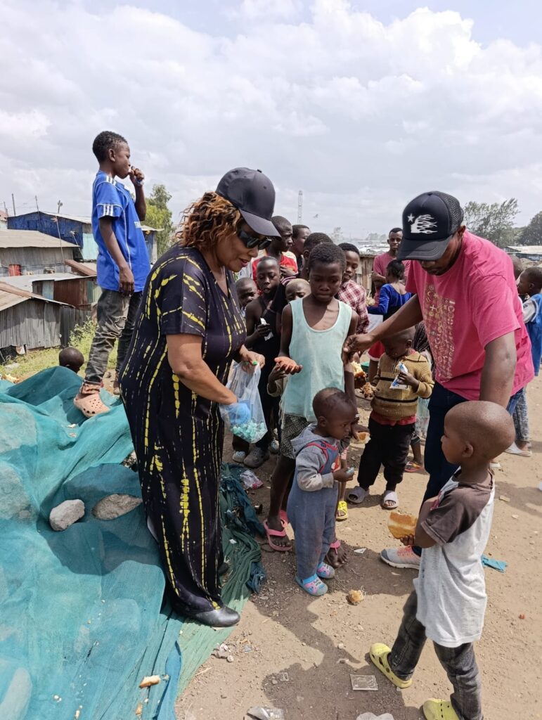 A lady serves children food